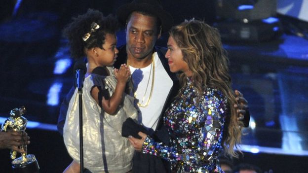 This Aug 24, 2014 file photo shows Beyonce on stage with Jay Z and their daughter Blue Ivy as she accepts the Video Vanguard Award at the MTV Video Music Awards in Inglewood, Calif.