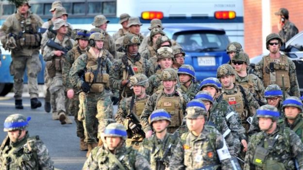 US and South Korean (blue head bands) marines take part in a US-South Korea joint landing operation in Pohang, South Korea (07 March 2016)