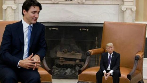 Justine Trudeau and a tiny Mr Trump in front of a White House fireplace