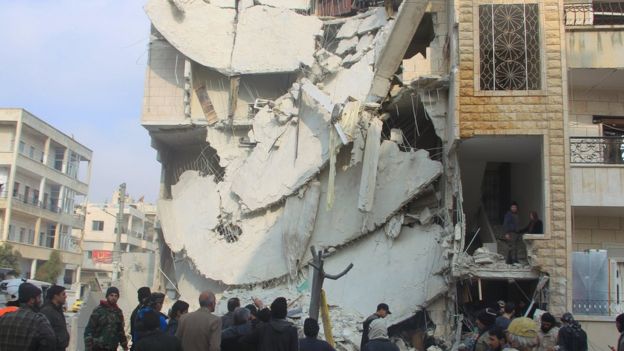 People inspect a site hit by what activists said were Russian air strikes in Idlib. Photo: December 2015