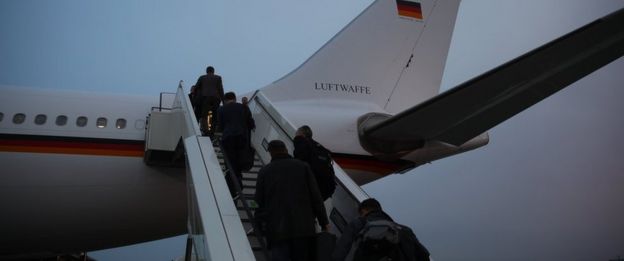 People board a Airbus A340 that stands at Berlin Tegel airport in Berlin. Monday March 13, 2017