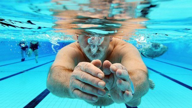 Man swims in swimming pool in Karlsruhe, southern Germany