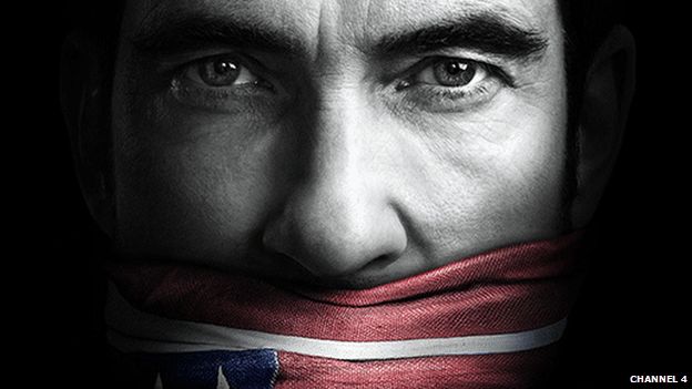 Dylan McDermott with an American flag tied round his mouth