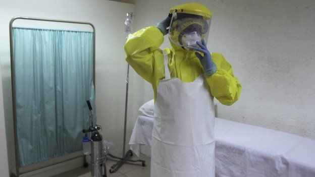 A health worker uses a protective suit during a presentation for the media at the international airport in Guatemala City 13 October 2014.