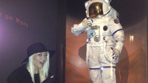 Maggie at the museum with astronaut model