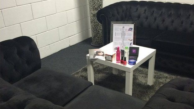 Paloma Faith's dressing room with two velvet black sofas and some free beauty products