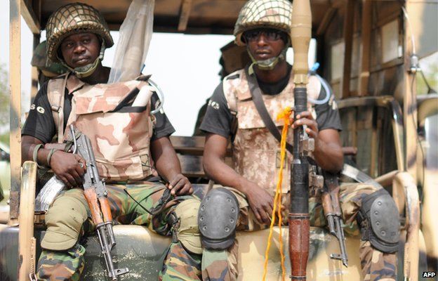 Nigerian soldiers ready for a patrol in the north of Borno state on 5 June 2013 in Maiduguri