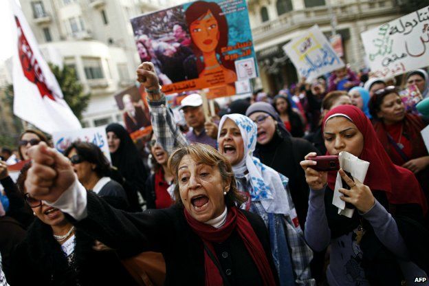 Egyptians chant slogans as they march in downtown Cairo to mark International Women's Day - 8 March 2013