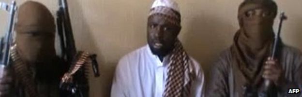 A screen grab taken from a video released on You Tube in April 2012, apparently showing Boko Haram leader Abubakar Shekau (centre) sitting flanked by militants