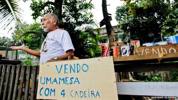 A resident mans a stand in Vila Uniao in January 2015