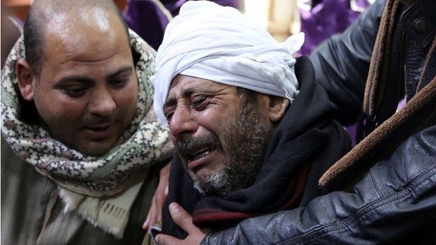 The father of a Coptic Christian killed in Libya weeps over his loss