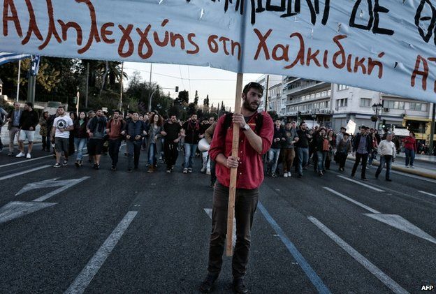 Opponents of an important gold mine project in northern Greece march in central Athens on 16 April 2015 holding a banner reading "Support to Halkidiki