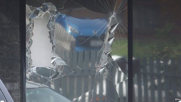 A broken window from a police raid at a house in Hallam, a suburb of Melbourne, where police made one of several arrest during terror raids in Melbourne, Australia, 18 April 2015