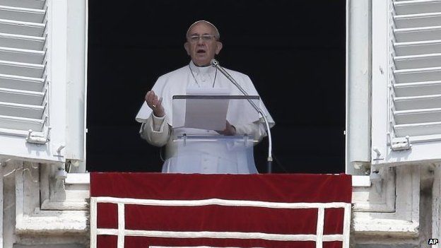 Pope Francis delivers his speech from the window of his studio overlooking St Peter's square during the Regina Coeli midday prayer, at the Vatican, 19 April 2015