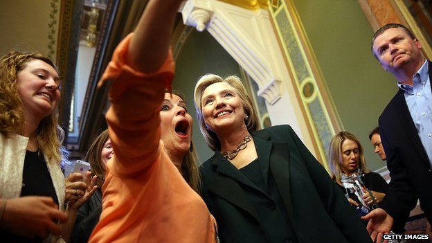 A fan poses with candidate Hillary Clinton.