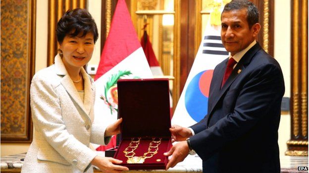 A handout picture made available by the Peruvian Presidency shows South Korean President Park Geun-Hye (L) being presented with the medal "Great Collar" of Sun's order by her Peruvian counterpart Ollanta Humala (R), in Lima, Peru, 20 April 2015