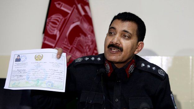 Kabul police chief Abdul Rahman Rahimi shows an education certificate of Farkhunda at a press conference following the arrest of suspects