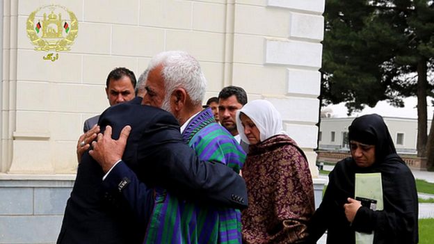 President Ghani hugs Farkhunda's father as the family visits the Presidential palace