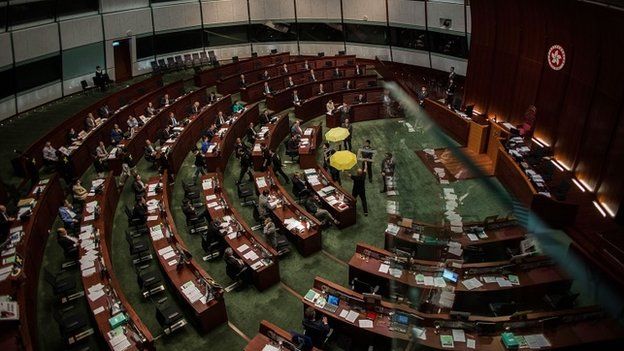 Pro-democracy lawmakers leave to boycott Hong Kong Chief Secretary Carrie Lam during a Legislative Council meeting on April 22, 2015 in Hong Kong, Hong Kong