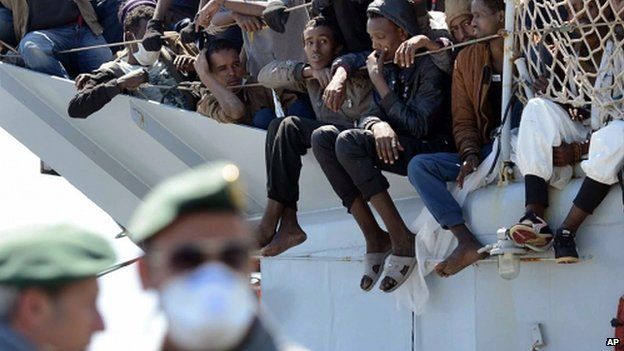 Migrants wait to disembark from an Italian ship in Salerno, Italy. Photo: 22 April 2015