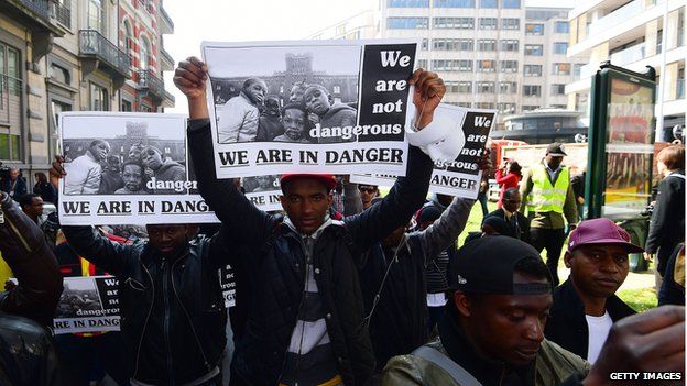 Activists and migrants take part in a march to outline the Mediterranean migrants crisis around the European Council in Brussels, on 23 April 2015
