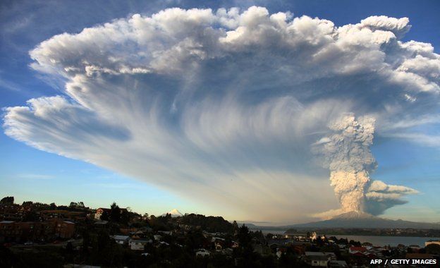 View from Puerto Montt, southern Chile, of a high column of ash and lava spewing from the Calbuco volcano, 22 April 2015