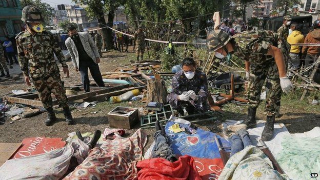 Rescuers identify bodies from the collapsed Sitapyla church in Kathmandu, Nepal, after the earthquake, 27 April 2015