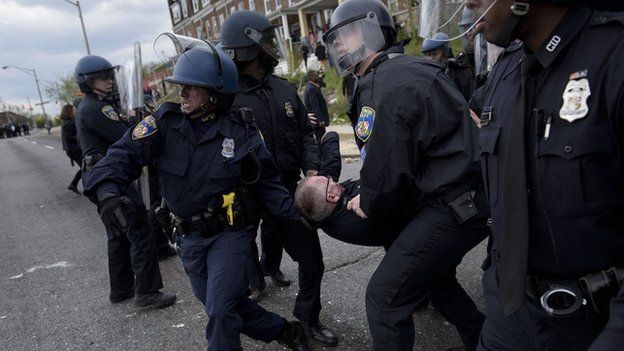 Police carrying their colleague away