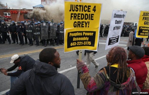 Demonstrators face off with police