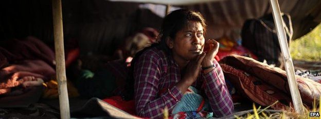 Woman in a tent in Kathmandu, Nepal (27 April 2015)