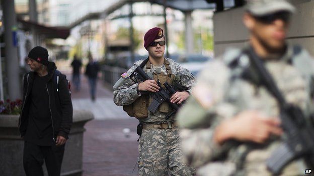 National Guardsmen patrol the inner harbour area