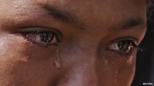 Anita, 14, mourns next to her father's body after it was recovered by a rescue team from a collapsed building, following Saturday's earthquake, in Kathmandu, Nepal on 1 May 2015