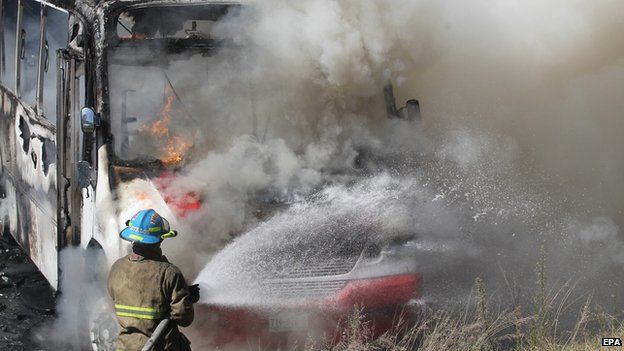 Firemen extinguish a fire in a bus in Guadalajara, Mexico, 01 May 2015