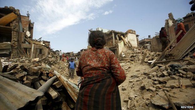 People works near the collapsed houses after last week's earthquake in Bhaktapur, Nepal May 2, 2015.