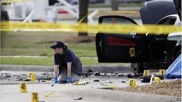 An investigator at the scene of a shooting in Garland, Texas, 4 May 2015