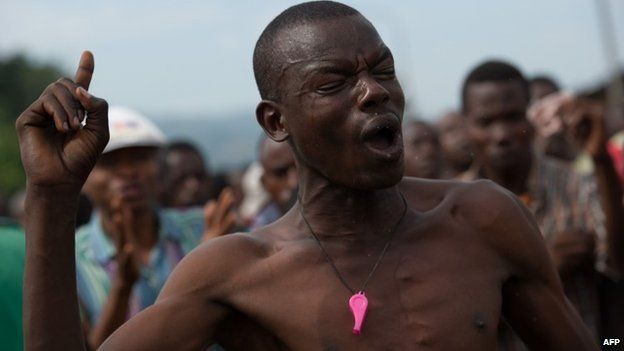 A protestor shouts against the army, who bulldozed a barricade in the Musaga neighbourhood of Bujumbura, on 7 May 2015