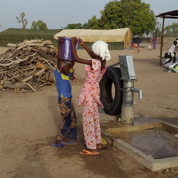 Two girls at water pump in Yola (May 2015)