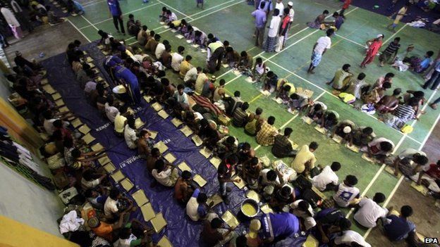 Rohingya refugees line up for breakfast in the sport stadium of Lhok Sukon, North Aceh, Sumatra, Indonesia, 11 May 2015.