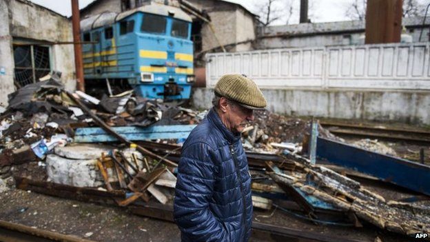 A man walks near a damaged train station in Debaltseve, eastern Ukraine. Photo: April 2015