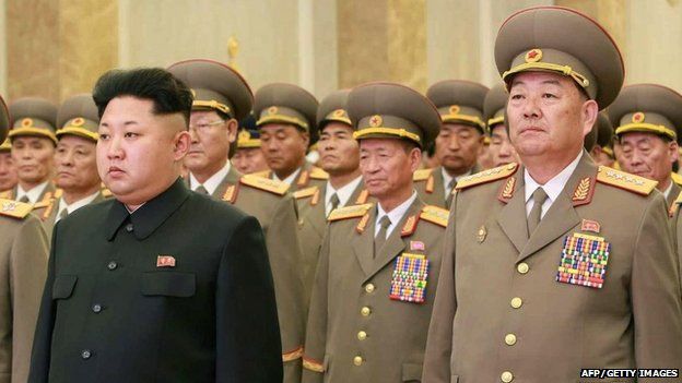 This photo taken on February 16, 2015 shows North Korean Defence Minister Hyon Yong-Chol (R) standing with North Korean leader Kim Jong-Un (front L) at Kumsusan Palace in Pyongyang
