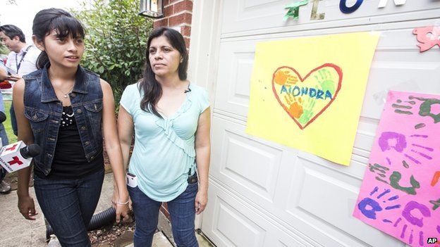 Alondra Diaz and her mother outside their house in Houston