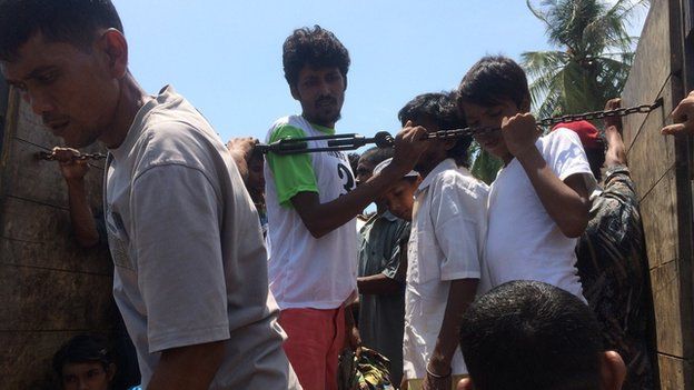 Migrants rescued by fisherman off the coast of Aceh