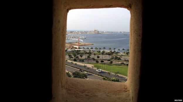 Luanda's popular beachfront area is seen through a window of a building in Angola's capital, in this picture taken on Friday 15 May 2015