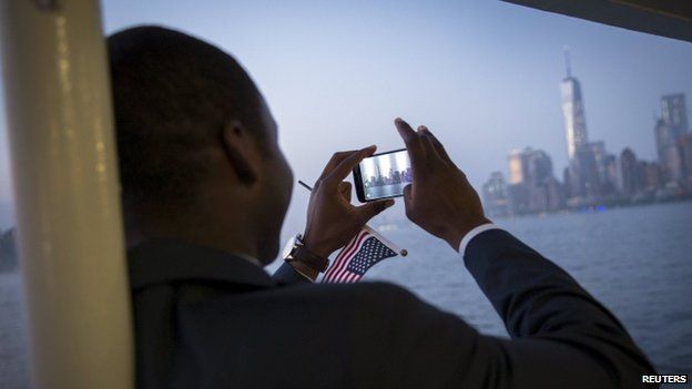 Isaac Osei-Acheampong, originally from Ghana who serves in the U.S. National Guard photographs the New York City Skyline and the new One World Trade Center tower