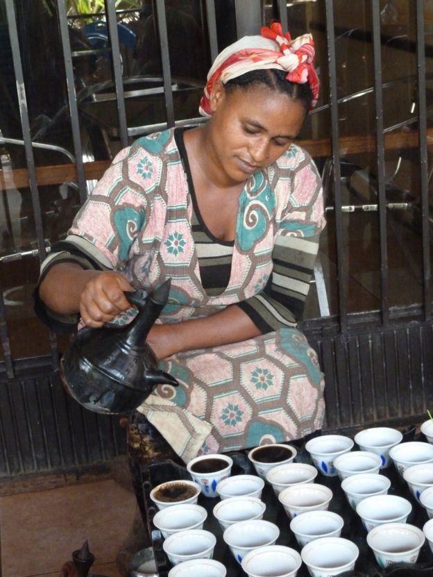 woman pouring coffee