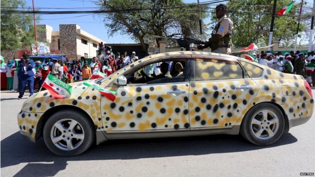 Policemen drive past in a salon car as they take part in a parade to mark the 24th self-declared independence day for the breakaway Somaliland nation from Somalia in capital Hargeisa, 18 May 2015
