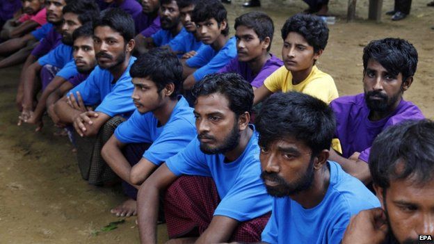 Rohingya Muslims from Bangladesh rescued by the Myanmar navy sit together at a temorary refugee camp in the village of Aletankyaw in the Maungdaw township of northern Rakhine state, Myanmar, 23 May 2015