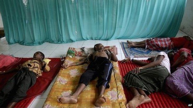 Rohingya migrant men receive medical treatment inside a makeshift clinic in Bayeun, Aceh province, Indonesia - 26 May 2015