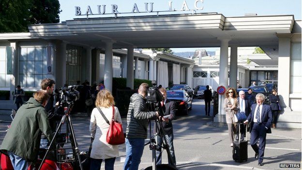 Members of the media stand outside the Baur au Lac hotel in Zurich, Switzerland, on 27 May 2015.