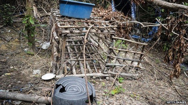 A small cage is seen at an abandoned migrant camp used by people-smugglers in a jungle at Bukit Wang Burma in the Malaysian northern state of Perlis, which borders Thailand, on May 26, 2015